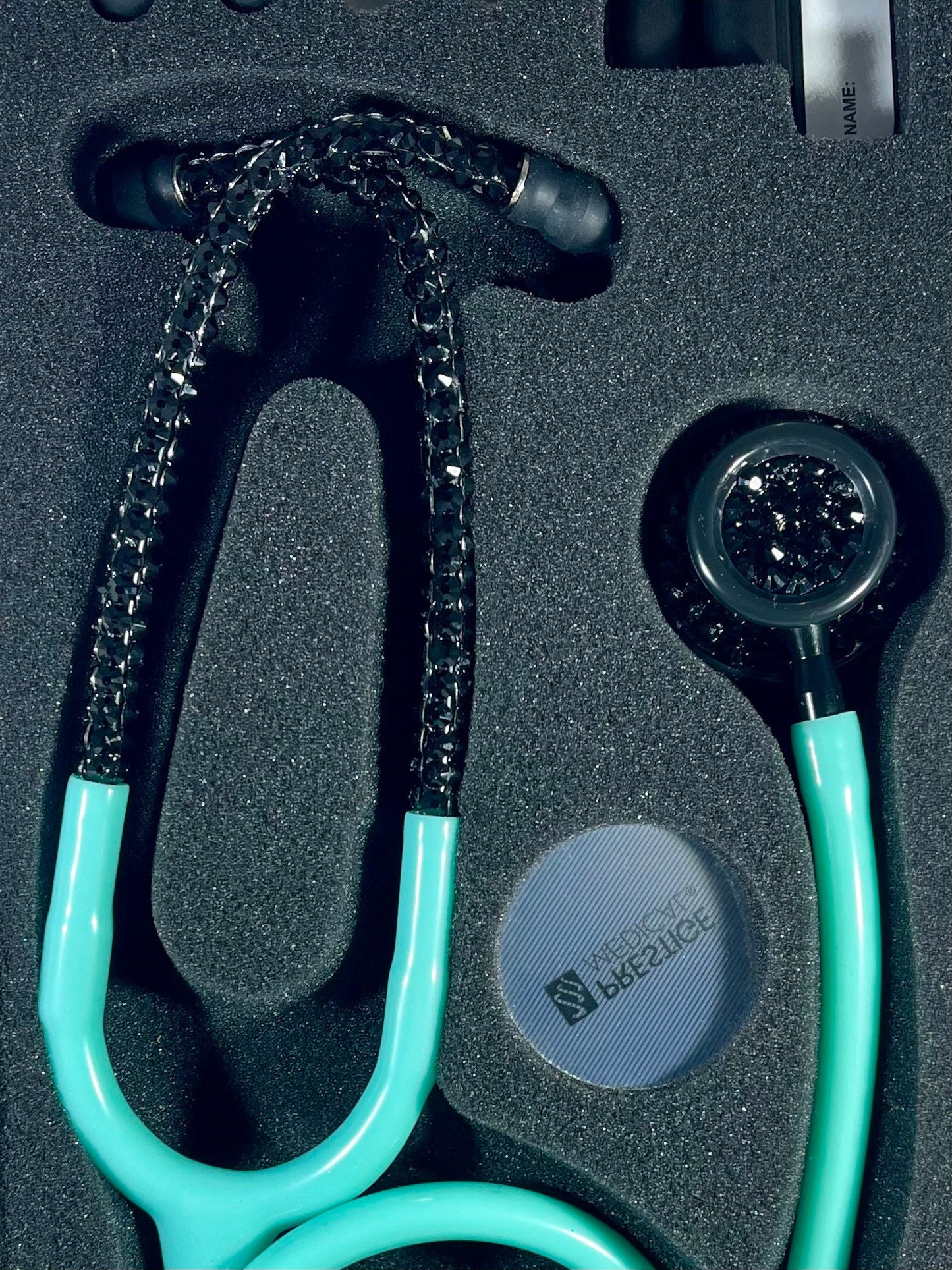 Prestige Medical Stethoscope, Model 121, Aqua Sea color tubing, individually placed black rhinestones on the black finish chest piece and headset designed by Blingbykey. See other listings for custom protection hard case.