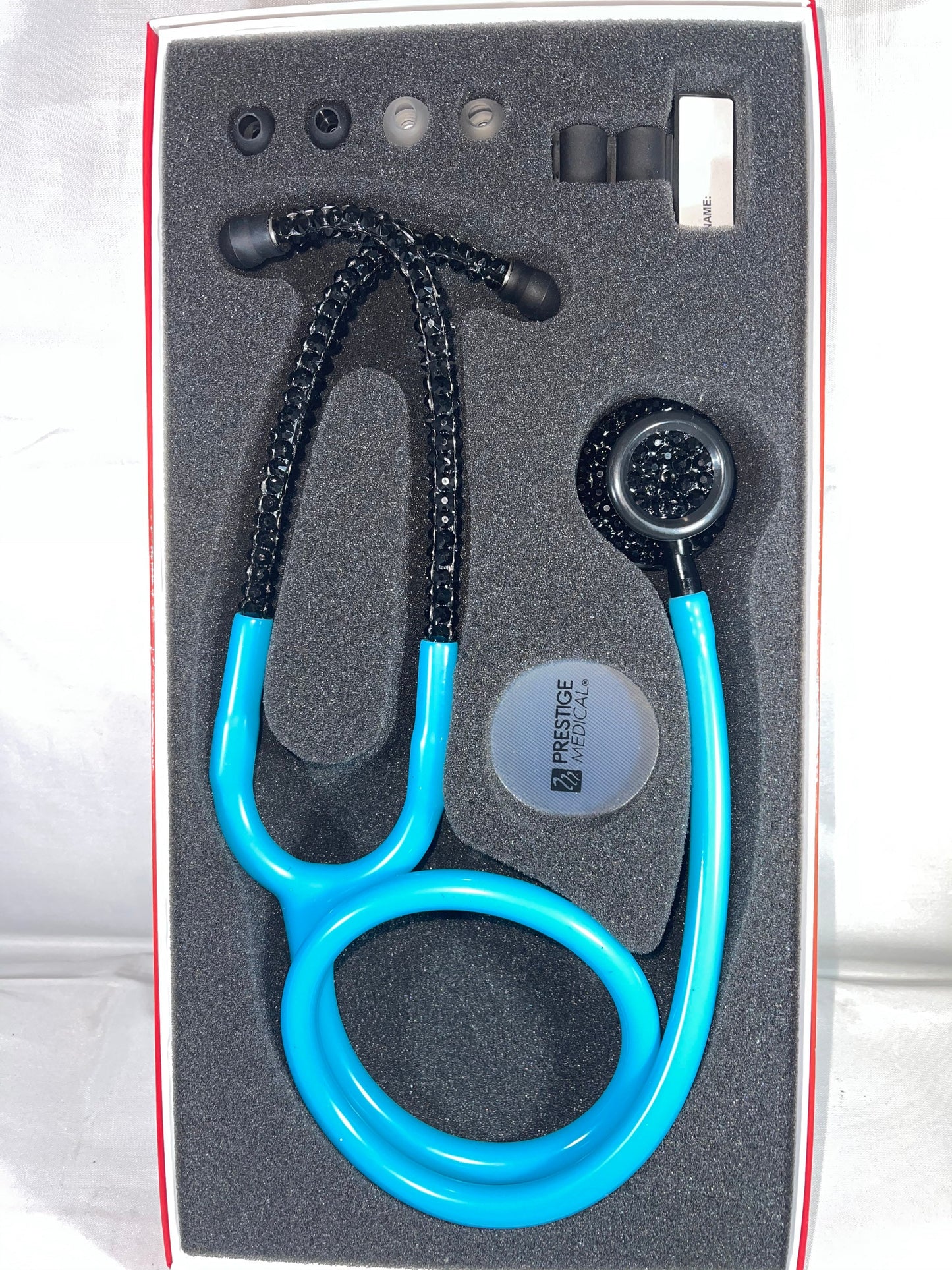 Cotton Candy Prestige Medical Stethoscope, Model 121, Neon Blue color tubing, individually placed Black rhinestones on the black finish chest piece and headset designed by Blingbykey. See other listings for custom protection hard case.