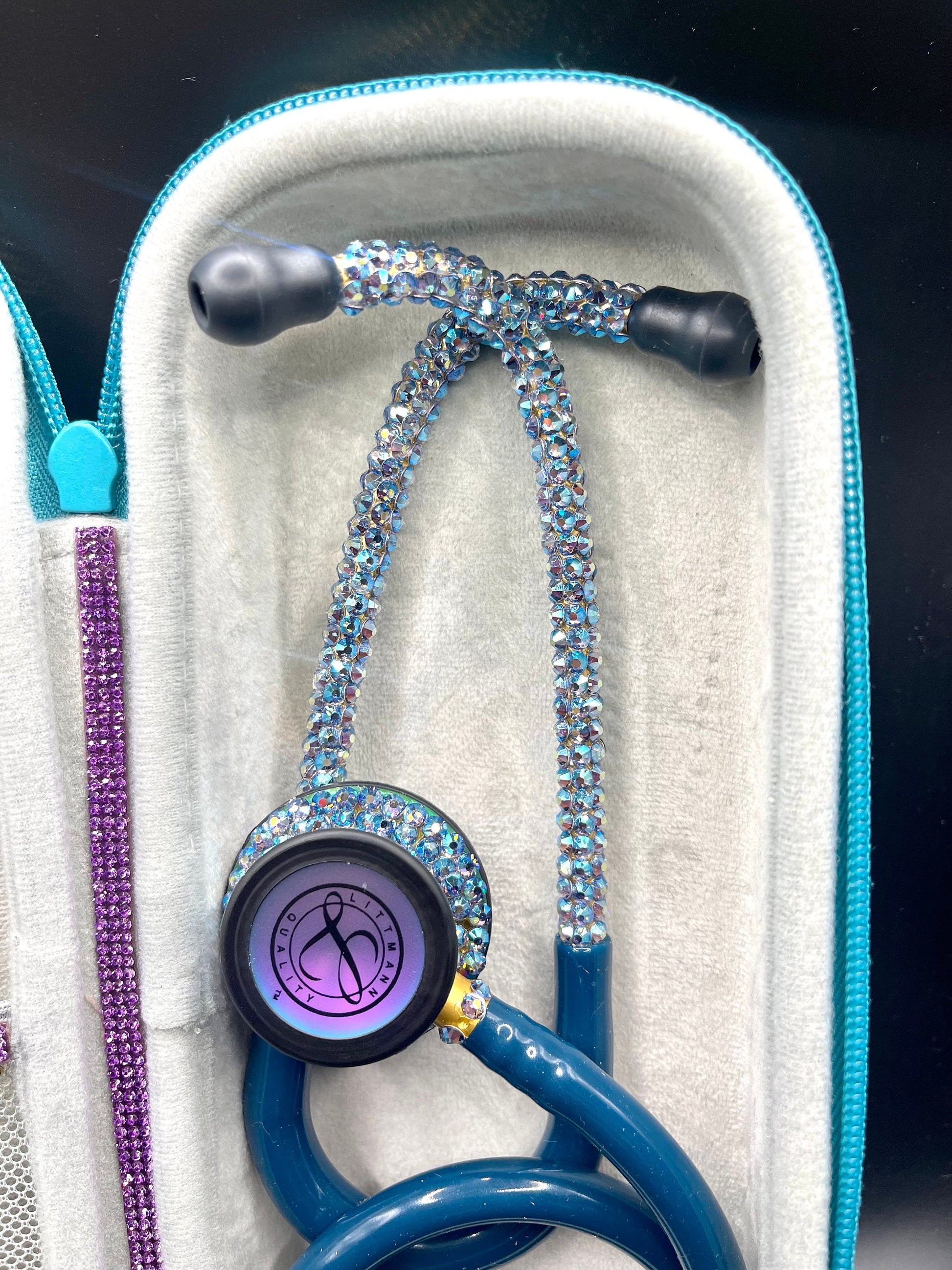 (Upclose) Be the Light Littmann Classic III Stethoscope, Rainbow Finish, Caribbean Blue color, individually placed Crystal AB. Inside Be the Light Stethoscope Case, meticulously crafted by Blingbykey,