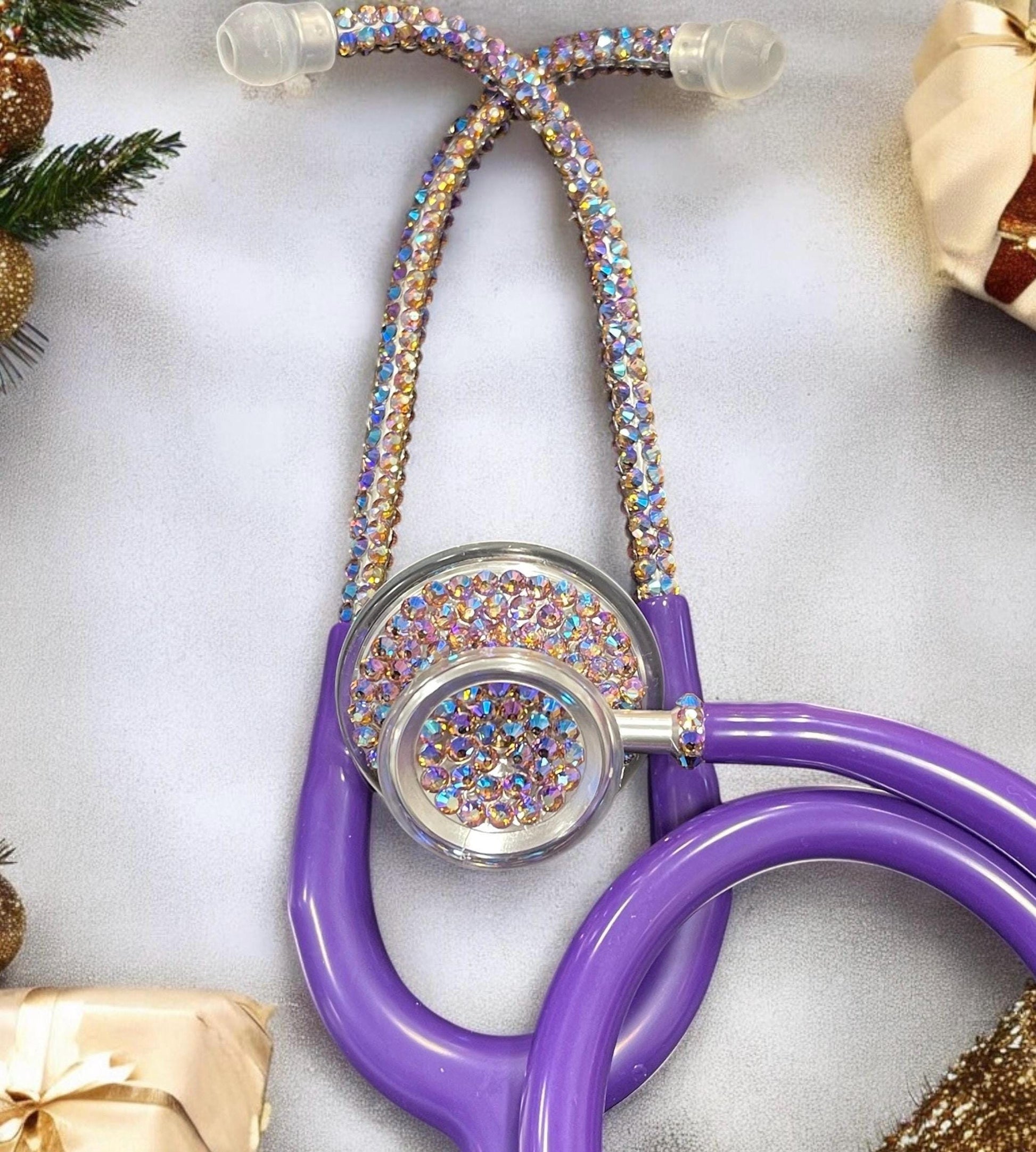 MDF Acoustica Stethoscope, purple rain tubing, silver finish with hand placed iridescent rhinestones. Different colors depending on your movement and angle.