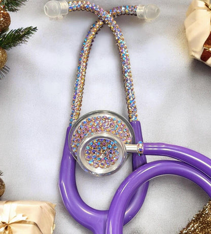 MDF Acoustica Stethoscope, purple rain tubing, silver finish with hand placed iridescent rhinestones. Different colors depending on your movement and angle.