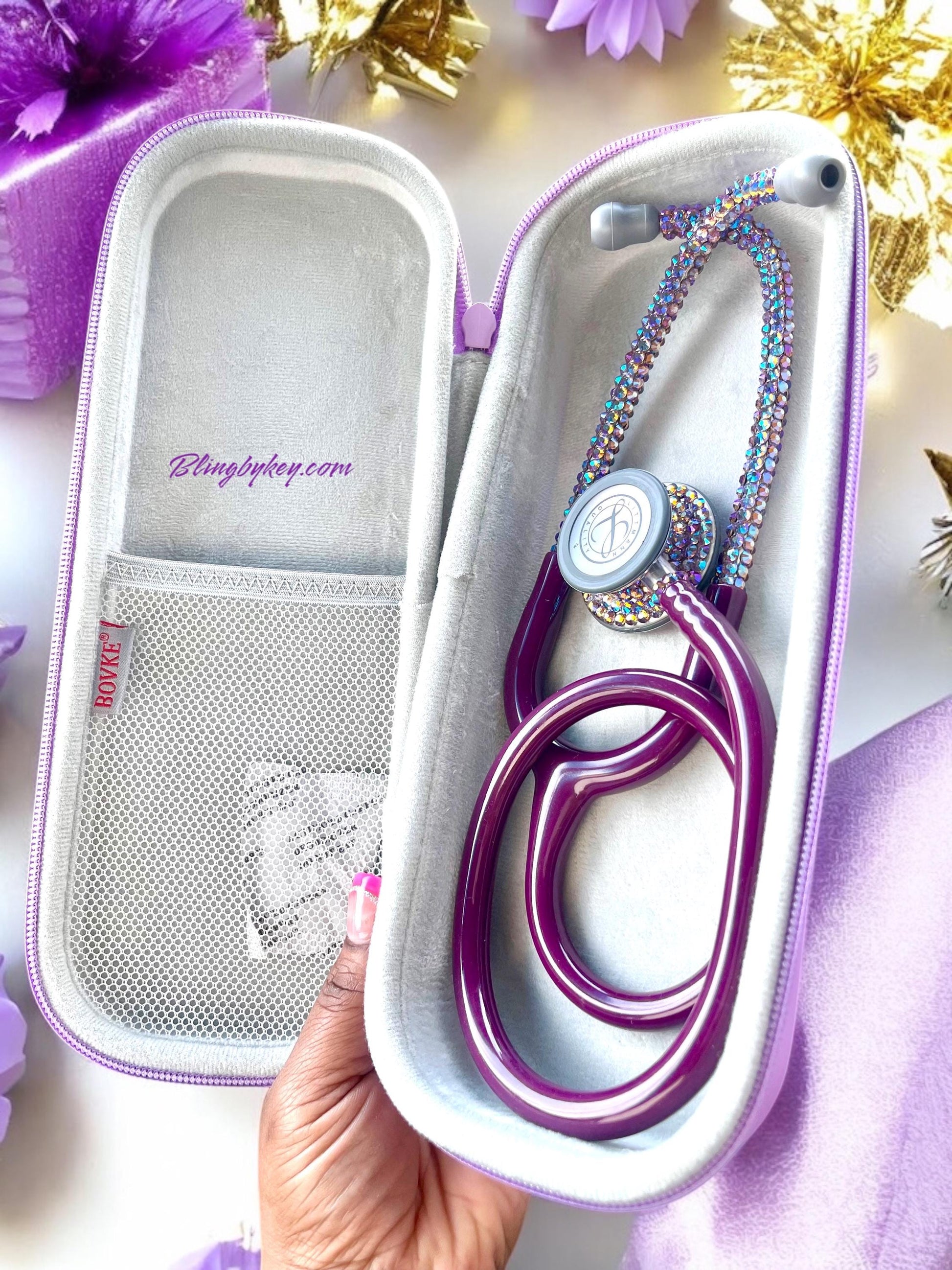 Endless Beauty Littmann Classic III Stethoscope, Plum color tubing, individually placed Iridescent rhinestones on the chest piece and headset designed by Blingbykey. Optional matching custom protection hard case.